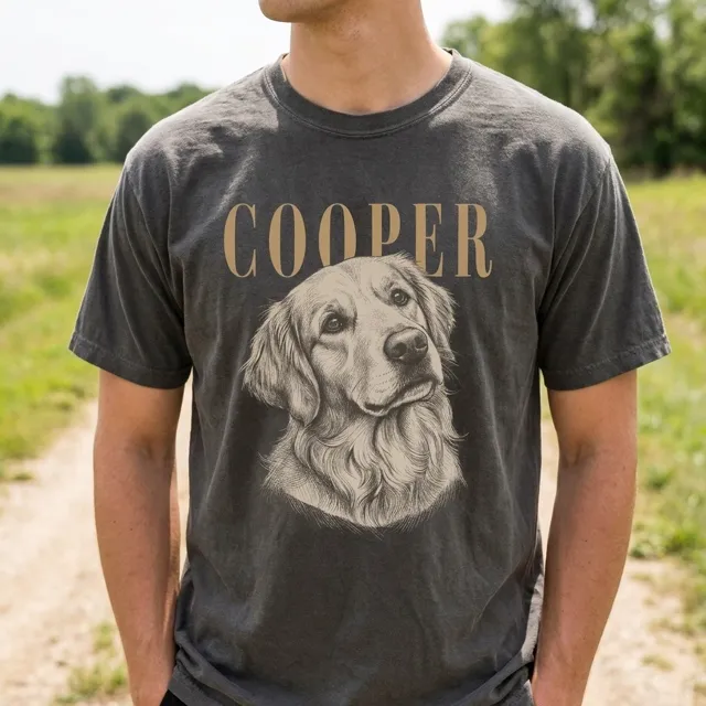 The single input photo: a man wearing a charcoal tee with a golden retriever sketch